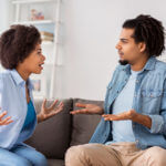 unhappy black couple having argument at home
