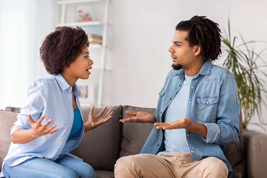 unhappy black couple having argument at home
