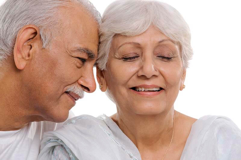 indian senior couple smiling
